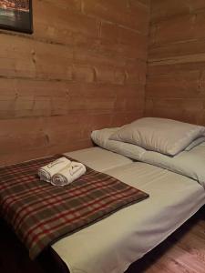 מיטה או מיטות בחדר ב-Chowancówka