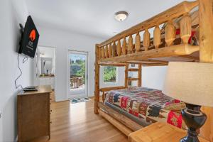 a bedroom with a bunk bed and a staircase at Rio Cantando in Wimberley
