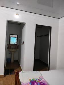 A bed or beds in a room at REST POINT HOMESTAY