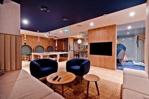 Telewizja i/lub zestaw kina domowego w obiekcie BlueApart Apartamenty Hotelowe Nexo II