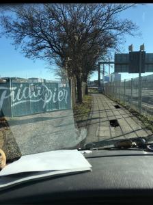 a view from a car windshield of a road with a sign at Schiff AHOY, Hotelschiff, Hausboot, Boot, Passagierschiff in Stuttgart