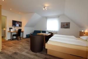 Postel nebo postele na pokoji v ubytování Hotel Klosterbräustuben