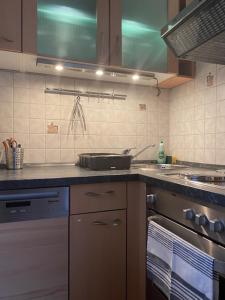 a kitchen with a sink and a stove at Apartment Skischanze in Garmisch-Partenkirchen