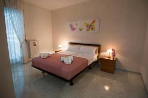 Postel nebo postele na pokoji v ubytování Casa Simone