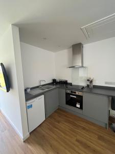 a kitchen with a sink and a stove at The Annexe in Felton