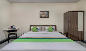 Letto o letti in una camera di Treebo Royal, Chandrapur