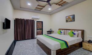 Letto o letti in una camera di Treebo Royal, Chandrapur