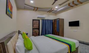 Letto o letti in una camera di Treebo Royal, Chandrapur