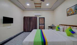 Letto o letti in una camera di Treebo Royal, Chandrapur