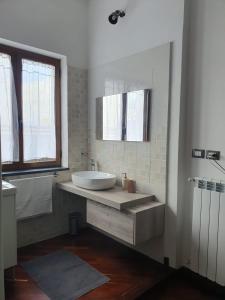 a bathroom with a sink and a tub in it at Ospitalità Il NOCE in Brusciano +48 photos