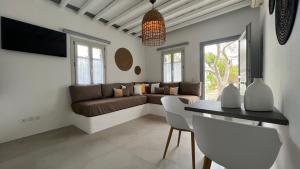 a living room with a couch and a table at Myrto Bungalows in Artemonas
