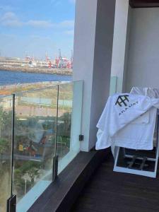 a white towel sitting on a balcony of a building at MARINA APARTMENT OCEAN VIEW in Casablanca