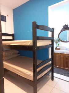 a couple of bunk beds in a room at Casa Oceano Azul in Guarujá