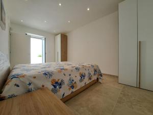 Giường trong phòng chung tại VILLA DEI GIGLI PESCOLUSE