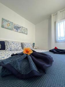a bedroom with a bed with a dress on it at Blue Ocean in Costa Teguise +25 photos
