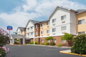 a row of apartment buildings in a parking lot at Fairfield Inn & Suites Corpus Christi in Corpus Christi