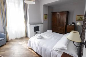 Postel nebo postele na pokoji v ubytování Albergo Ristorante Il Verbano