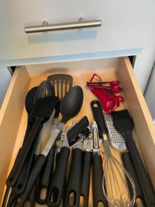 a drawer filled with lots of kitchen utensils at Charming New 1-BA/1-BR Home on an 60 Acre Property (Sleeps Up To 4) in Sardis