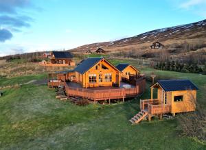 an aerial view of a house in a field at LL Properties - Cabin With Amazing View in Akureyri
