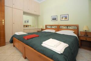 Posteľ alebo postele v izbe v ubytovaní Tinos View Apartments