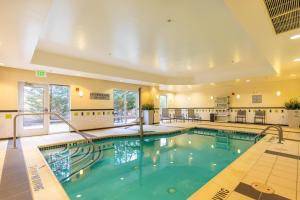 a large indoor pool in a hotel with at Fairfield Inn & Suites Carlisle in Carlisle