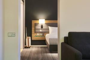 Postel nebo postele na pokoji v ubytování Moxy Ludwigshafen + 35 fotografií