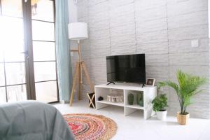 TV a/nebo společenská místnost v ubytování Casa Gioia