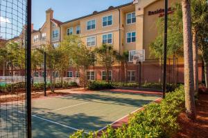 a tennis court in front of a building at Residence Inn Sandestin at Grand Boulevard in Destin