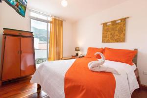 Postel nebo postele na pokoji v ubytování HOSTAL DEL RÍO