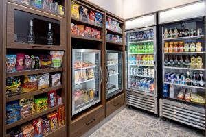 a refrigerator filled with lots of food and drinks at Residence Inn by Marriott Valencia in Valencia