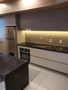 Kuchyň nebo kuchyňský kout v ubytování MyHome - Suíte de Luxo próximo ao Shopping Iguatemi e Consulado Americano + 19 fotografií