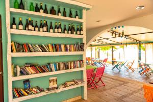 a room with shelves filled with bottles of wine at Sea View Apartments - Aheloy in Ravda