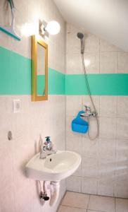 a bathroom with a sink and a shower at Amber in the centar in Kaštela +61 photos