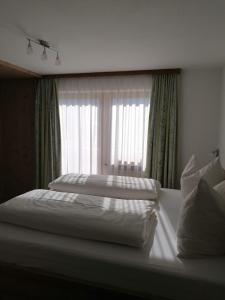 سرير أو أسرّة في غرفة في هاوس بيرغكرانز