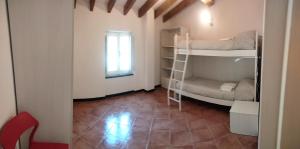 a room with two bunk beds and a window at Casa dell'Arco Civico 35 in San Fruttuoso +28 photos