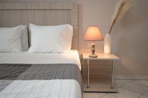 Postel nebo postele na pokoji v ubytování Abelia Boutique Rooms