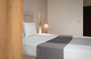 Postel nebo postele na pokoji v ubytování Abelia Boutique Rooms