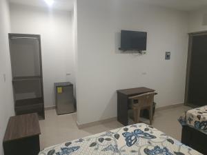 Postel nebo postele na pokoji v ubytování Hotel Romo