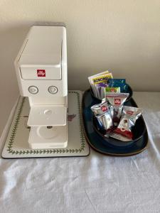 a white printer sitting next to a plate of food at The Bee House in San Giovanni