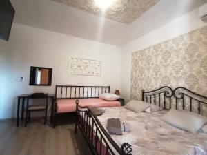 Postel nebo postele na pokoji v ubytování Slim apartman i sobe
