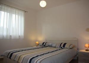 Postel nebo postele na pokoji v ubytování Apartments Car