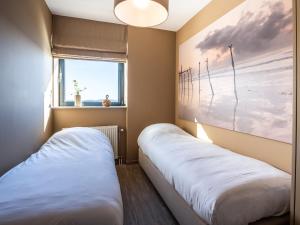 Ένα ή περισσότερα κρεβάτια σε δωμάτιο στο Apartment in Veere with Lake Views & Marina