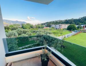 a balcony with two potted plants and a view at Villa Barovic - Premium apartment in Mlini