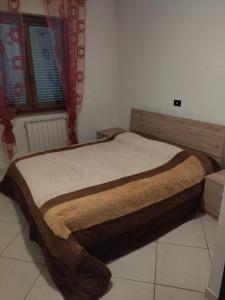 a bed sitting in a room with at Villa Circe in San Felice Circeo