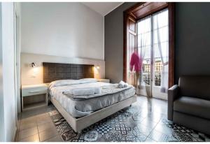 A bed or beds in a room at New Gallery