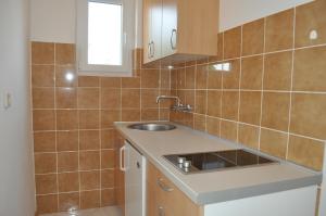 Kuchyňa alebo kuchynka v ubytovaní Apartments Smilja + 37 fotografií