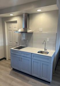 a kitchen with a sink and a stove at Quality Inn Tracy I-205 in Tracy