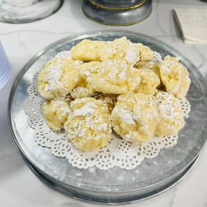 a glass plate of food with powdered sugar on it at EC Reed's Mercantile and Hotel in Marble Hill