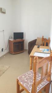 a living room with a couch and a table at CASA PATY, Estudio rural. Sant Ferran FORMENTERA in Sant Ferran de Ses Roques