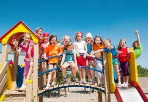 a group of children posing for a picture on a playground at Modern 6 Berth Caravan At Martello Beach In Essex Ref 29002sv in Clacton-on-Sea